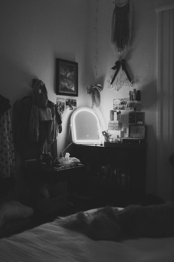 A black and white photo of a bedroom