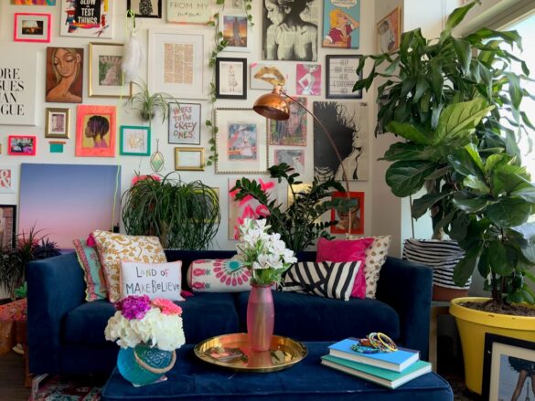 An eclectic gallery wall in a colorful maximalist apartment home in Denver, Colorado